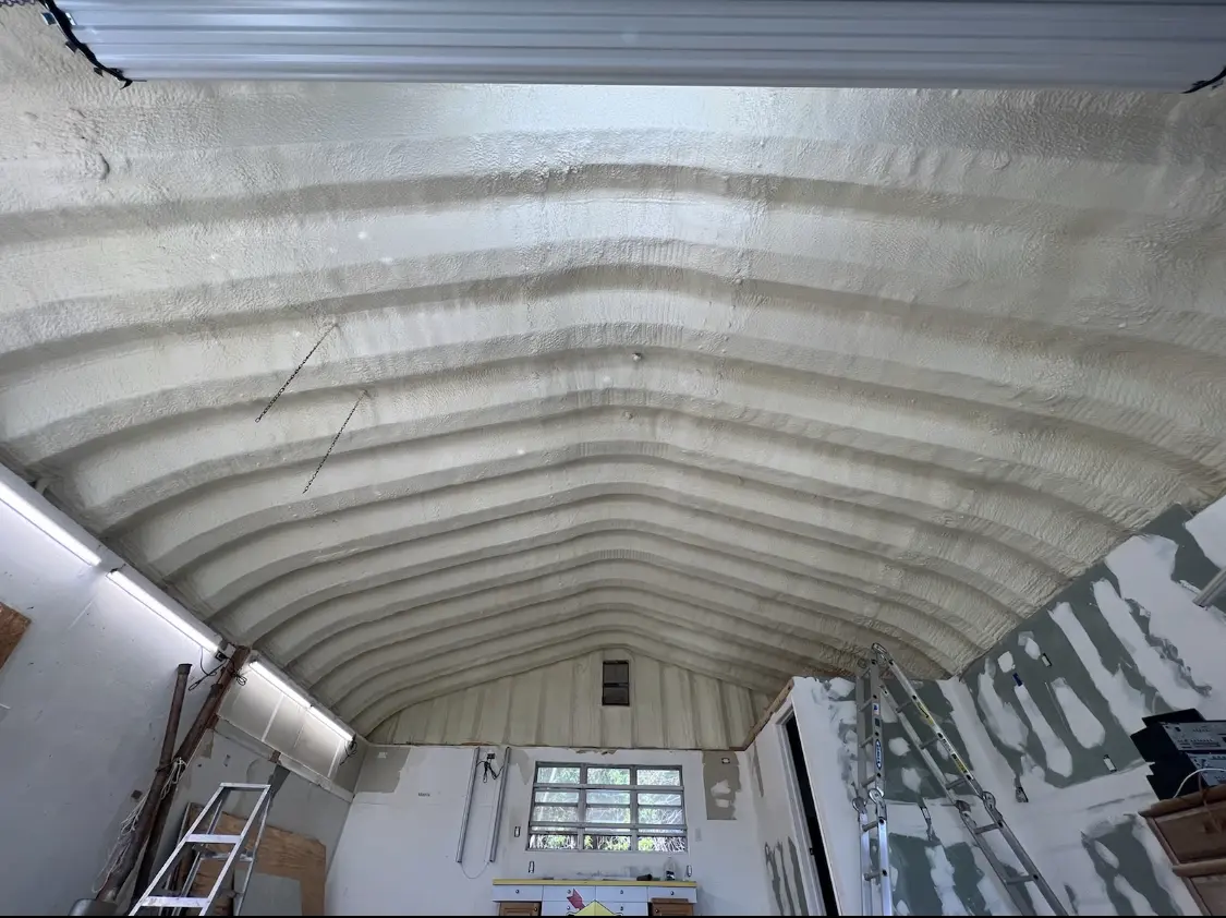 Spray polyurethane foam applied to the underside of a metal roof deck in Rose